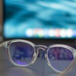 Blue-Light Glasses: What the Cochrane Review Found A pair of silver-framed eyeglasses resting on a white table