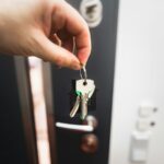 Renting is not throwing money away, but the real argument is stranger A person holding a key to a door