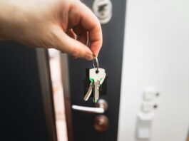 Renting is not throwing money away, but the real argument is stranger A person holding a key to a door
