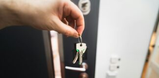 Renting is not throwing money away, but the real argument is stranger A person holding a key to a door