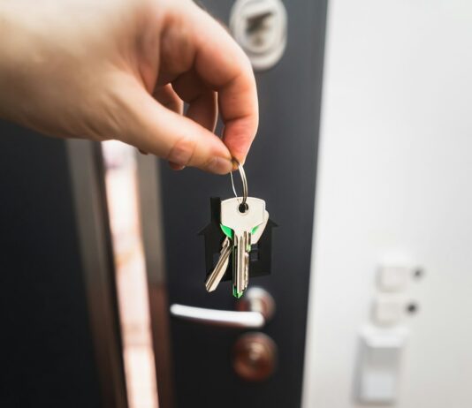 Renting is not throwing money away, but the real argument is stranger A person holding a key to a door