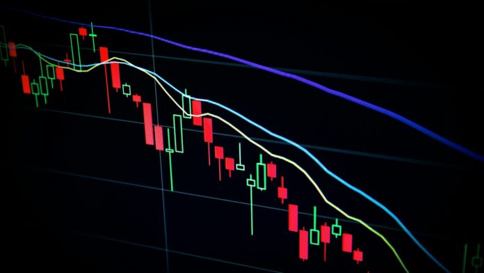 market-candlestick-chart A stock market candlestick chart displayed on a dark screen