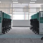 The four-day week trials mostly didn’t test a four-day week Empty office chairs at cubicles