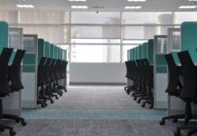 The four-day week trials mostly didn’t test a four-day week Empty office chairs at cubicles