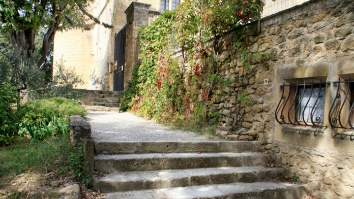 stone-steps-village Stone steps leading up to an ivy-covered building