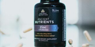 The Vitamin D Trials Nobody Talks About A bottle of vitamin supplements on a plain surface