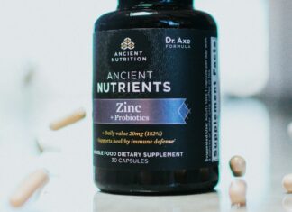 The Vitamin D Trials Nobody Talks About A bottle of vitamin supplements on a plain surface
