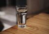 A glass of water on a wooden surface